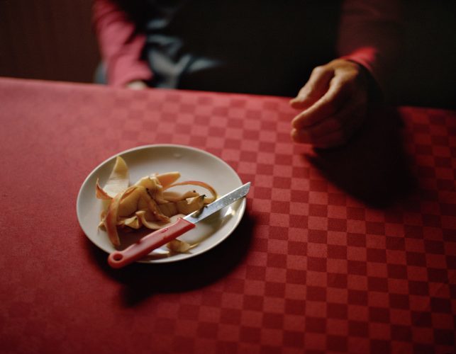 Apple peels on the kitchen table after my grandmother's daily afternoon fruit snack.